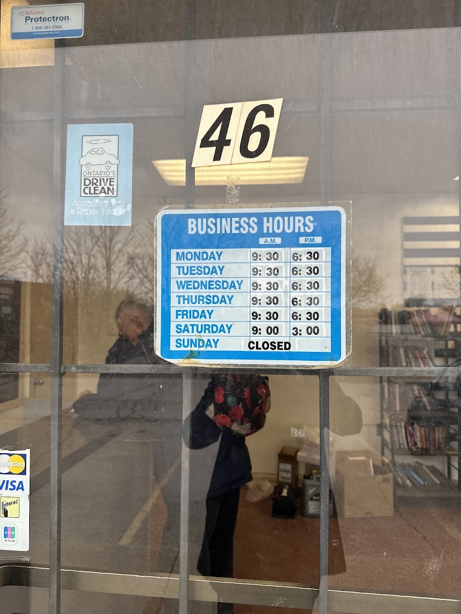 Door at Unit 46 with posted business hours